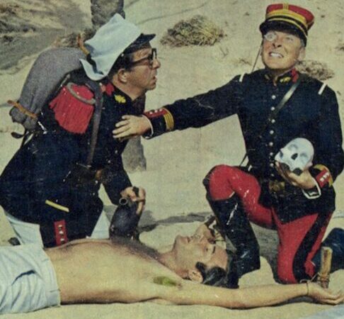 Lobby card for the film Carry On Follow That Camel, featuring Kenneth Williams and Phil Silvers
